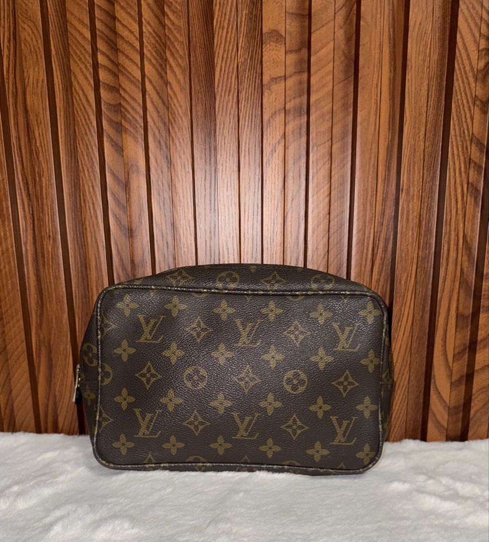 Vintage Louis Vuitton Toiletry Pouch 26 (Category: Luxury Bags & Wallets) located in Subic. Submitted by luxshoppe88 (Listing ID 1431533913, Image 1). Description: Authentic Vintage Louis Vuitton Toiletry Pouch 26 in classic Monogram canvas. Features a zip closure with a gold-tone zipper pull. No code its a vintage piece. The interior is lined with a brown leather. Made in France. The pouch has a spacious interior for storing cosmetics and other 