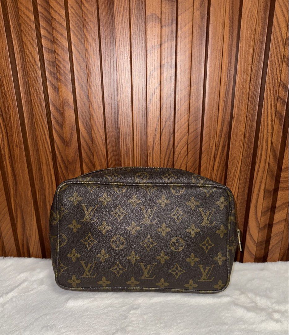 Vintage Louis Vuitton Toiletry Pouch 26 (Category: Luxury Bags & Wallets) located in Subic. Submitted by luxshoppe88 (Listing ID 1431533913, Image 3). Description: Authentic Vintage Louis Vuitton Toiletry Pouch 26 in classic Monogram canvas. Features a zip closure with a gold-tone zipper pull. No code its a vintage piece. The interior is lined with a brown leather. Made in France. The pouch has a spacious interior for storing cosmetics and other 