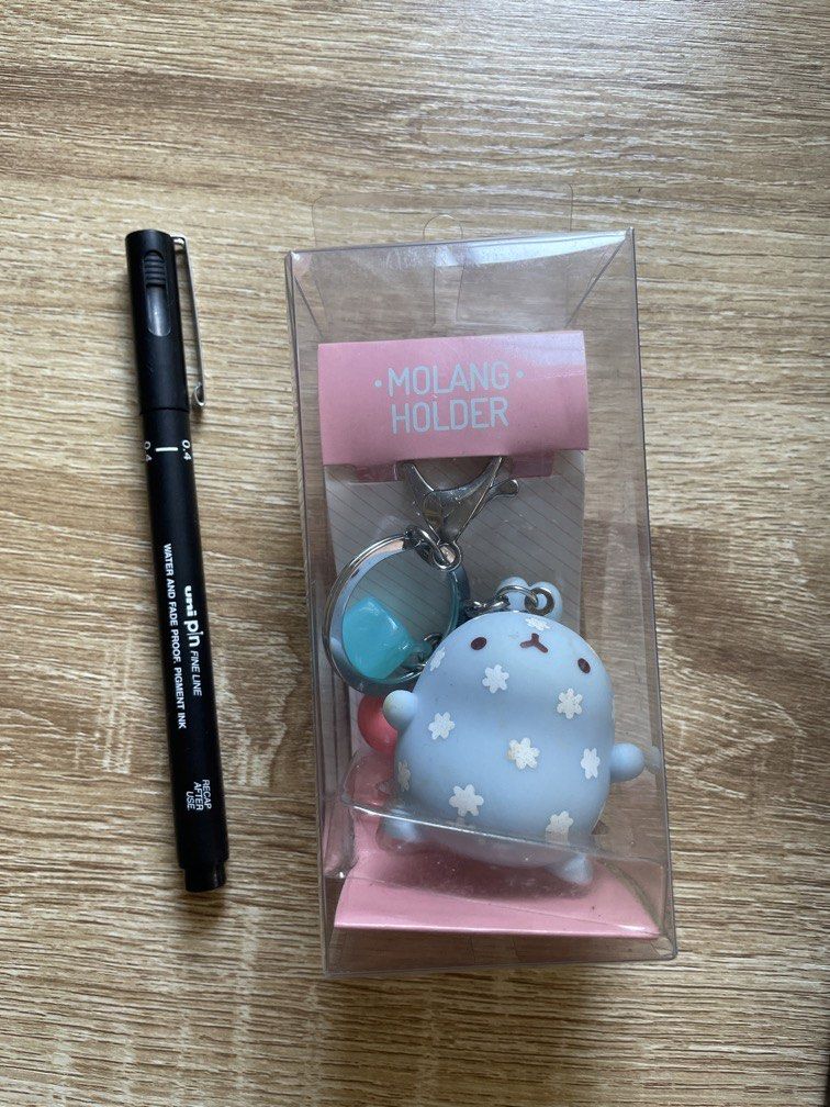 Molang Holder Keychain (Category: Character Goods) located in Angeles City. Submitted by cessianne (Listing ID 1431422538, Image 1). Description: Features Molang, a chic and cute rabbit Hard plastic material With two bead charms.
