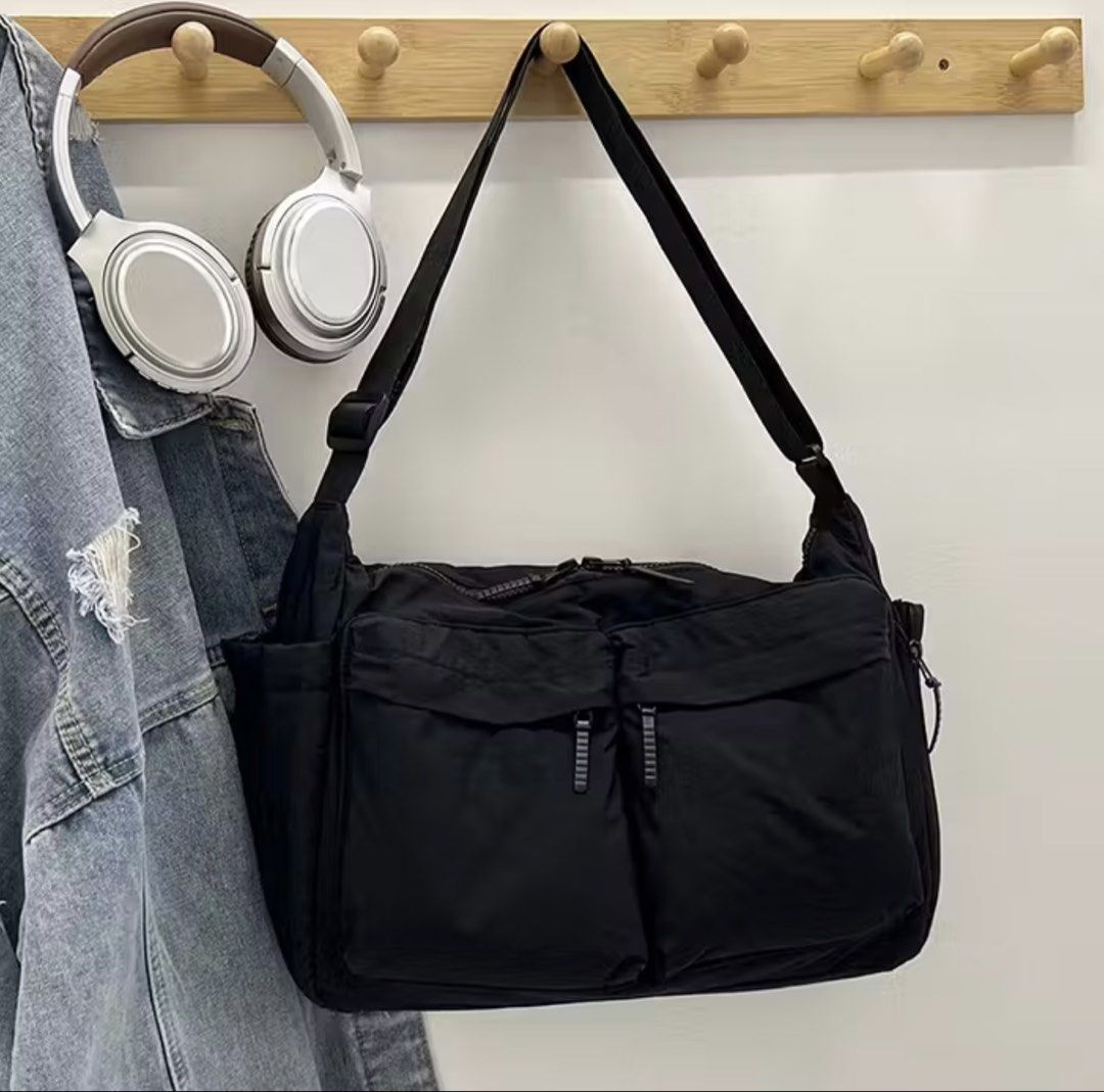 Mumu Messenger Bag - Black (Category: Luxury Bags & Wallets) located in Quezon City. Submitted by melalog (Listing ID 1431520577, Image 1). Description: - Mumu Messenger Bag - Made of durable black nylon - Perfect for casual occasions - Plain pattern - Messenger bag style - Dimensions: 34cm (length) x 26cm (height) x 10cm (width) - Lightweight: 0.3kg - Multiple compartments for storage.