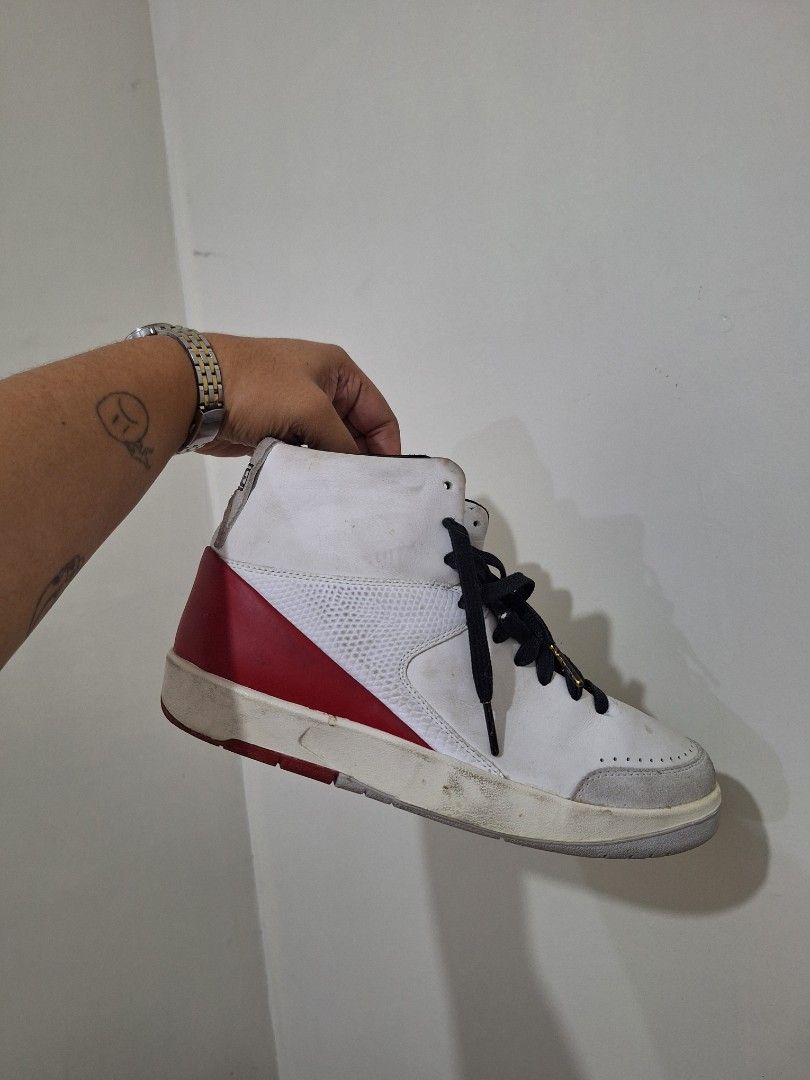 Nike Air Jordan 2 Retro High (Category: Sneakers) located in Makati City. Submitted by pengsuppp (Listing ID 1431569789, Image 3). Description: Nike Air Jordan 2 Women's SE Retro High sneakers - Colorway: White, Red, and Black - Features a white leather upper - Red accents on sole and heel - Black laces - Iconic Nike logo - Size: US 8.5 - Gift from my ate, and this was bought in Dubai - Original box and keychain is nasa bahay namin sa province, I