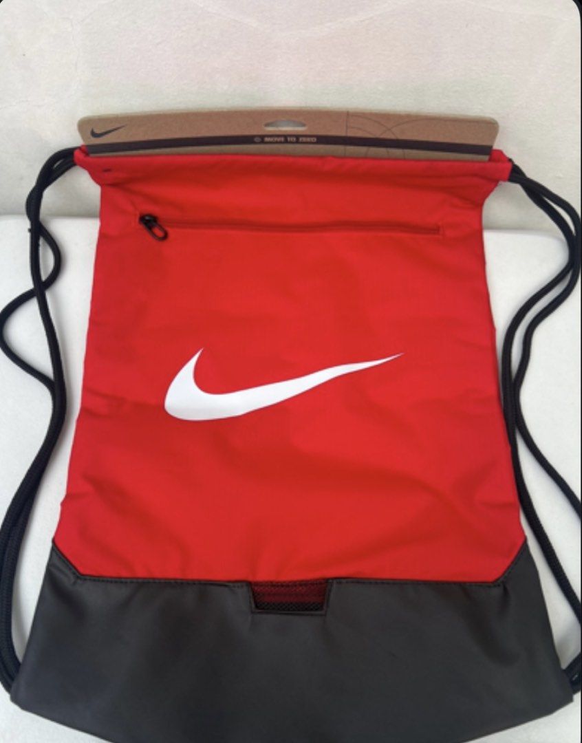 Nike Drawstring Bag (Category: Backpacks) located in Quezon City. Submitted by soohthings (Listing ID 1431502551, Image 2). Description: - Nike drawstring bag - Available in red and blue - Zippered pocket at the top front - Original ; bought directly in Nike store in US.