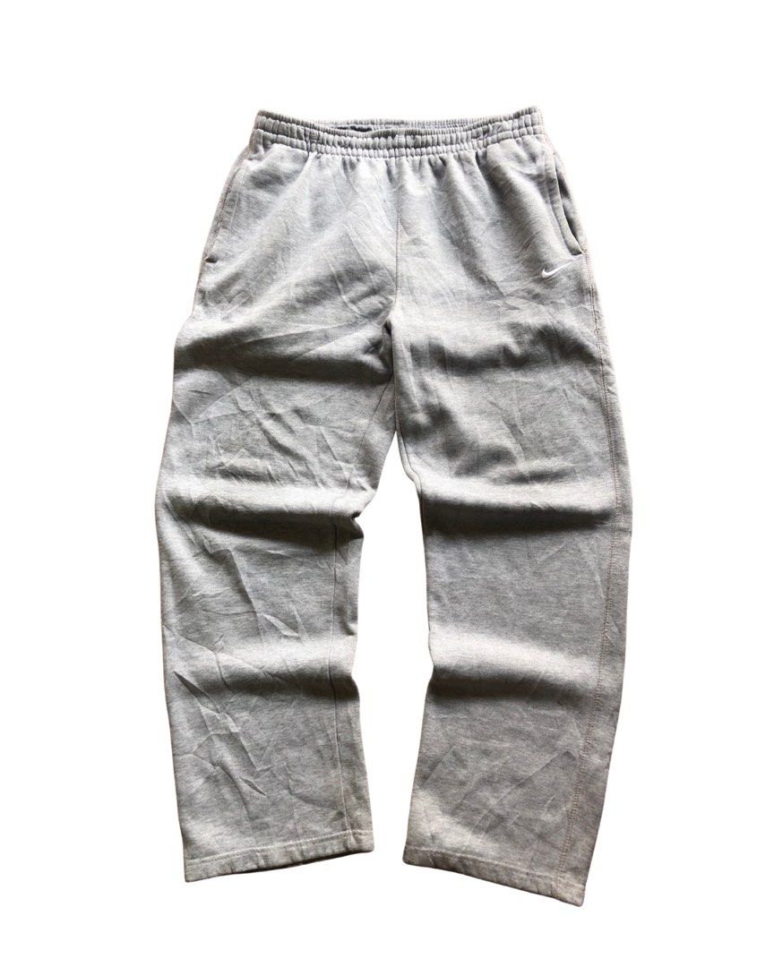 Nike Solo Swoosh open-hem fleece pants (Category: Joggers) located in Quezon City. Submitted by f1ysthrift (Listing ID 1431493521, Image 1). Description: Good condition Color rate 10/10 Issue pinholes Measurements Length 40" Waist 32" Leg Opening 9".