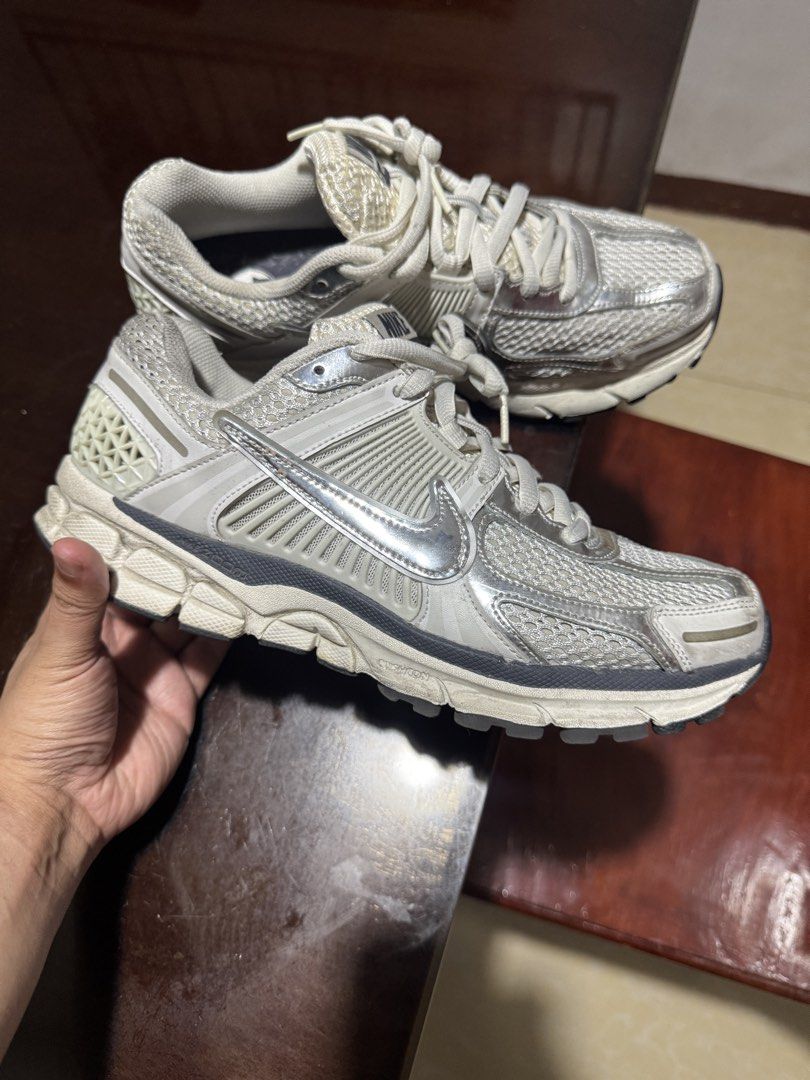 Nike Vomero 5 Photon Dust Metallic Silver (Category: Sneakers) located in Quezon City. Submitted by rg1996 (Listing ID 1431504918, Image 2). Description: Size 9 mens (10.5 women on tag) With original box Small hole on right toe (see last pic).