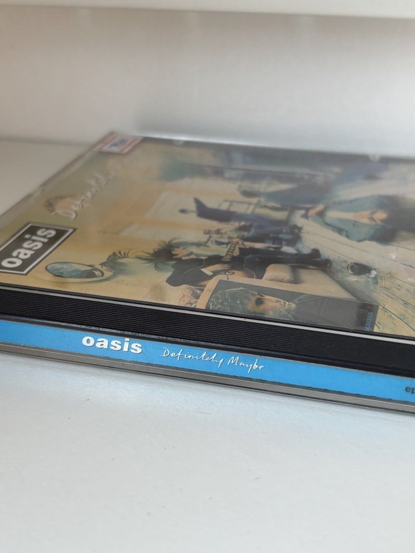Oasis - Definitely Maybe CD (Category: CDs & DVDs) located in Manila. Submitted by cosmikai_ (Listing ID 1431437253, Image 3). Description: Features tracks like "Rock 'n' Roll Star", "Live Forever", and "Supersonic". Selling for the same price I got it but price is negotiable MOP GCash/BPI MOD J&T/Lalamove/Meet up in UP Diliman 📍Pasig City.