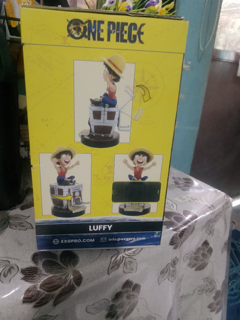 One Piece Luffy Phone and Controller Holder (Category: Figurines & Statues) located in Binan City. Submitted by ollkorrect (Listing ID 1431568788, Image 3). Description: - One Piece Luffy Phone & Controller Holder - Designed to hold your phone and controller while charging - Features Luffy on a controller-shaped base - Manufactured by EXGPRO - Perfect for One Piece fans!.