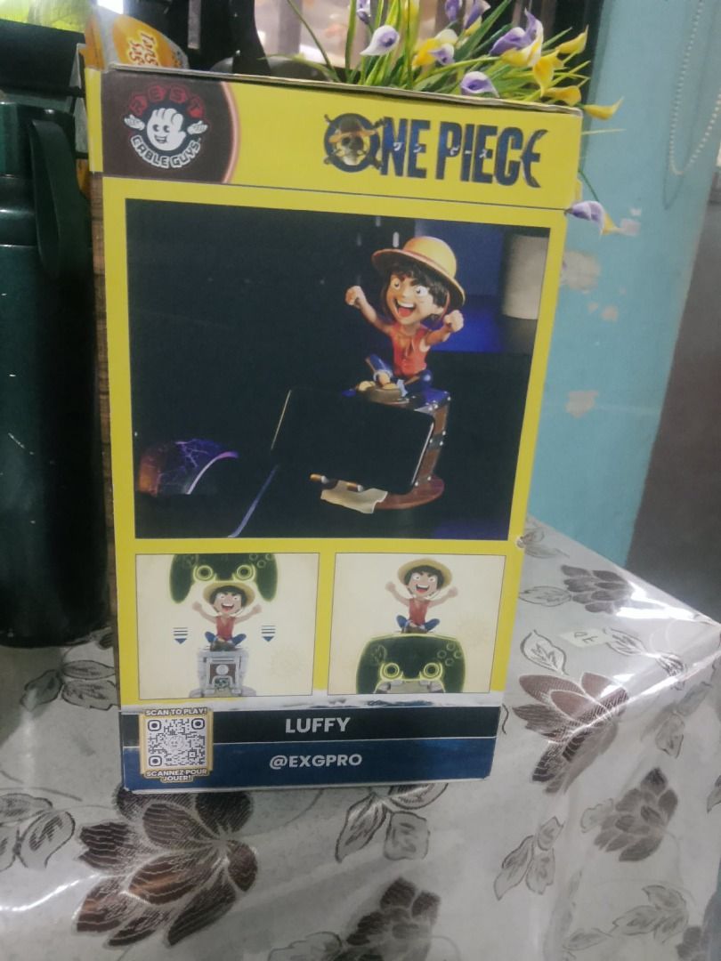 One Piece Luffy Phone and Controller Holder (Category: Figurines & Statues) located in Binan City. Submitted by ollkorrect (Listing ID 1431568788, Image 2). Description: - One Piece Luffy Phone & Controller Holder - Designed to hold your phone and controller while charging - Features Luffy on a controller-shaped base - Manufactured by EXGPRO - Perfect for One Piece fans!.