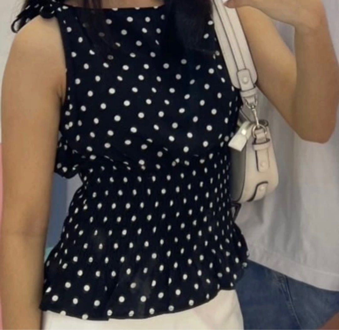 Polka Dot Tie-Shoulder Top (Category: Sleeveless) located in Bacolod City. Submitted by girlydecluttering (Listing ID 1431415691, Image 1). Description: - Polka dot print - Tie-shoulder straps - Smocked waist - Peplum hem - Sleeveless - Round neckline - Lightweight and flowy fabric - Suitable for casual and dressy occasions - white and black 180 each.