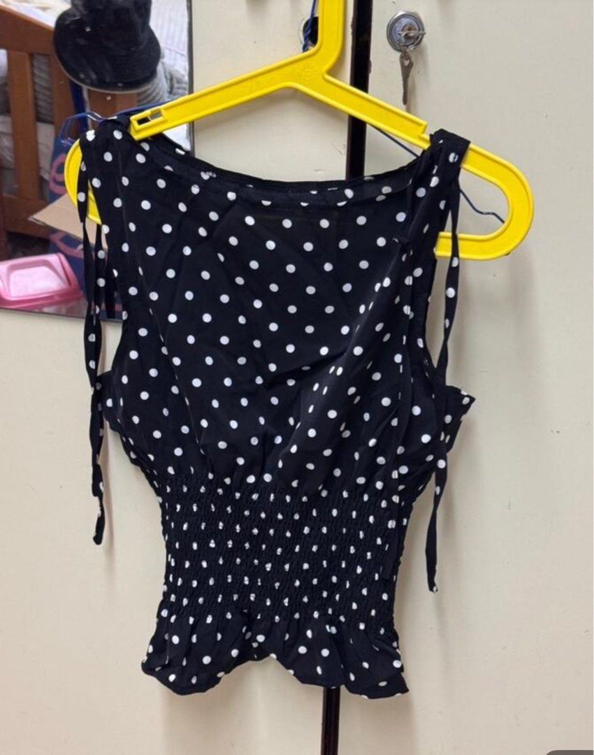 Polka Dot Tie-Shoulder Top (Category: Sleeveless) located in Bacolod City. Submitted by girlydecluttering (Listing ID 1431415691, Image 3). Description: - Polka dot print - Tie-shoulder straps - Smocked waist - Peplum hem - Sleeveless - Round neckline - Lightweight and flowy fabric - Suitable for casual and dressy occasions - white and black 180 each.