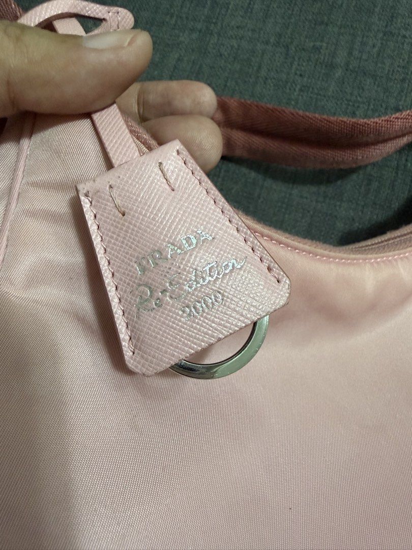 Prada Re-Edition 2000 Mini Bag (Category: Luxury Bags & Wallets) located in Manila. Submitted by jjensiyy (Listing ID 1431473664, Image 2). Description: - Authentic Prada Re-Edition 2000 mini bag - Pink nylon exterior and strap - Prada logo triangle and tag - Zipper closure - Interior Prada logo label.