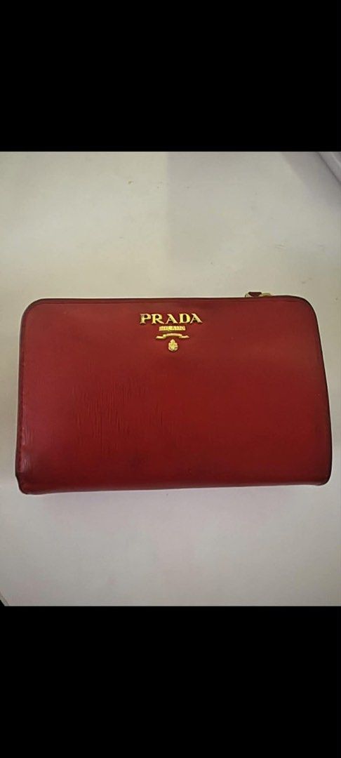 Prada Vitello Move Zip Around Wallet (Category: Luxury Bags & Wallets) located in Muntinlupa City. Submitted by megserafico (Listing ID 1431432750, Image 1). Description: - Authentic Prada zip around wallet - Red Vitello Move leather - Multiple card slots - Bill compartments - Zippered coin pocket - Includes authenticity cards - Gold-tone Prada logo - Red leather interior - Made in Italy.