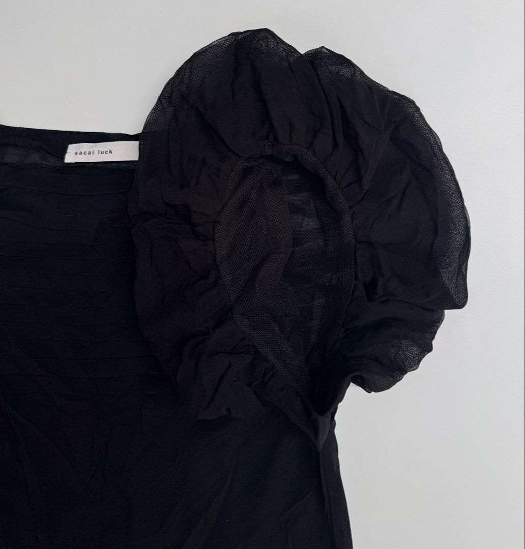 Sacai - Black Mesh Ruffled Puff Sleeve Blouse (Category: Blouses) located in Caloocan City. Submitted by opulent.finds (Listing ID 1431393852, Image 3). Description: Size 1, fit small to medium womens Width: 17” Lenght: 24” Prestine condition✨ No flaws .