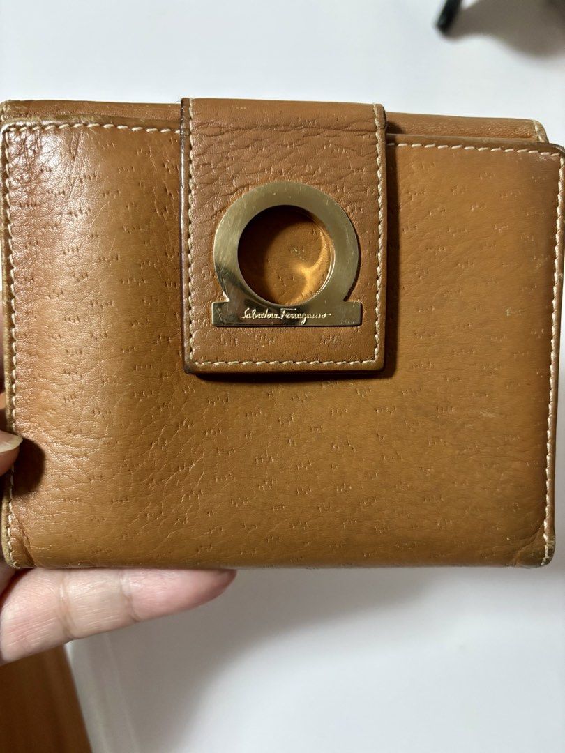 Salvatore Ferragamo Leather Wallet (Category: Luxury Bags & Wallets) located in Paranaque City. Submitted by tanjnetluxurypreloved (Listing ID 1431487366, Image 1). Description: - Authentic Salvatore Ferragamo wallet - Warm brown leather - Gold-tone clasp with logo - Multiple card slots - Coin compartment - Made in Italy.
