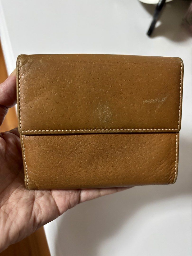 Salvatore Ferragamo Leather Wallet (Category: Luxury Bags & Wallets) located in Paranaque City. Submitted by tanjnetluxurypreloved (Listing ID 1431487366, Image 2). Description: - Authentic Salvatore Ferragamo wallet - Warm brown leather - Gold-tone clasp with logo - Multiple card slots - Coin compartment - Made in Italy.