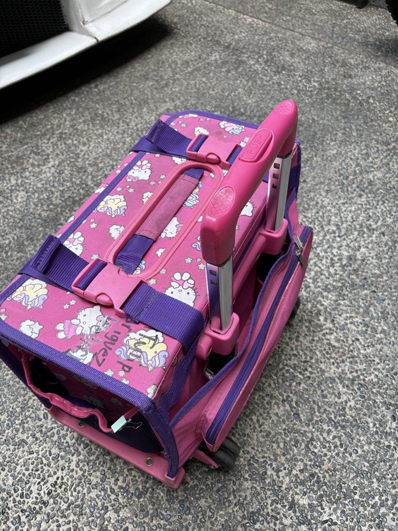 School Trolley Bag (Category: Backpacks) located in Marikina City. Submitted by igmtsisters (Listing ID 1431378511, Image 2). Description: Needs Cleaning‼️ 6 Wheels, Handles, Zippers are in good working condition‼️ Hello Kitty Box type Rotates 360 degrees Heavy-duty, box-like main compartment to prevent books from bending Inside Width 14” Length 10” RFS: Moving up- transition to back pack. .