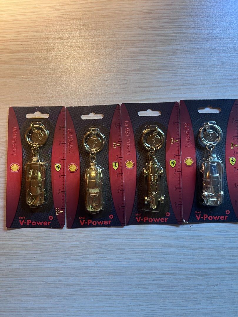 Shell Ferrari ORIG keychain (Category: Vintage Collectibles) located in Mandaluyong City. Submitted by goodfair (Listing ID 1431461355, Image 1). Description: Promotional metal keychains from the Shell and Ferrari partnership, showcasing classic Ferrari car models. • The keychains are based on specific historic Ferraris, including the Enzo Ferrari, 250 GTO, Ferrari 156 F1, and Ferrari P3. a • These items were released as promotional collectibles 