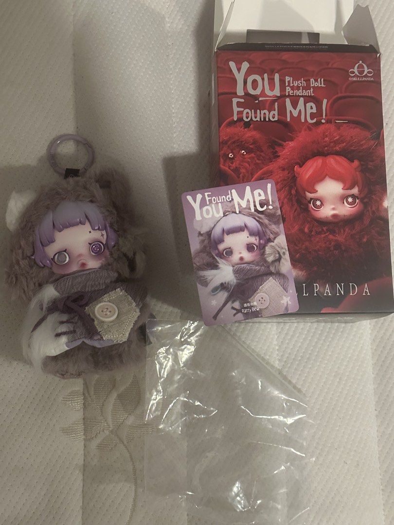 Skullpanda You Found Me! Plush Doll Pendant (Category: Plushies & Soft Toys) located in Makati City. Submitted by elenank.595 (Listing ID 1431389730, Image 2). Description: Adorable Skullpanda plush doll pendant in purple and gray “Ratty Bear” from “You found me”. Includes original box, collectible card, and keychain. Cute outfit with button detail. Perfect for collectors!.