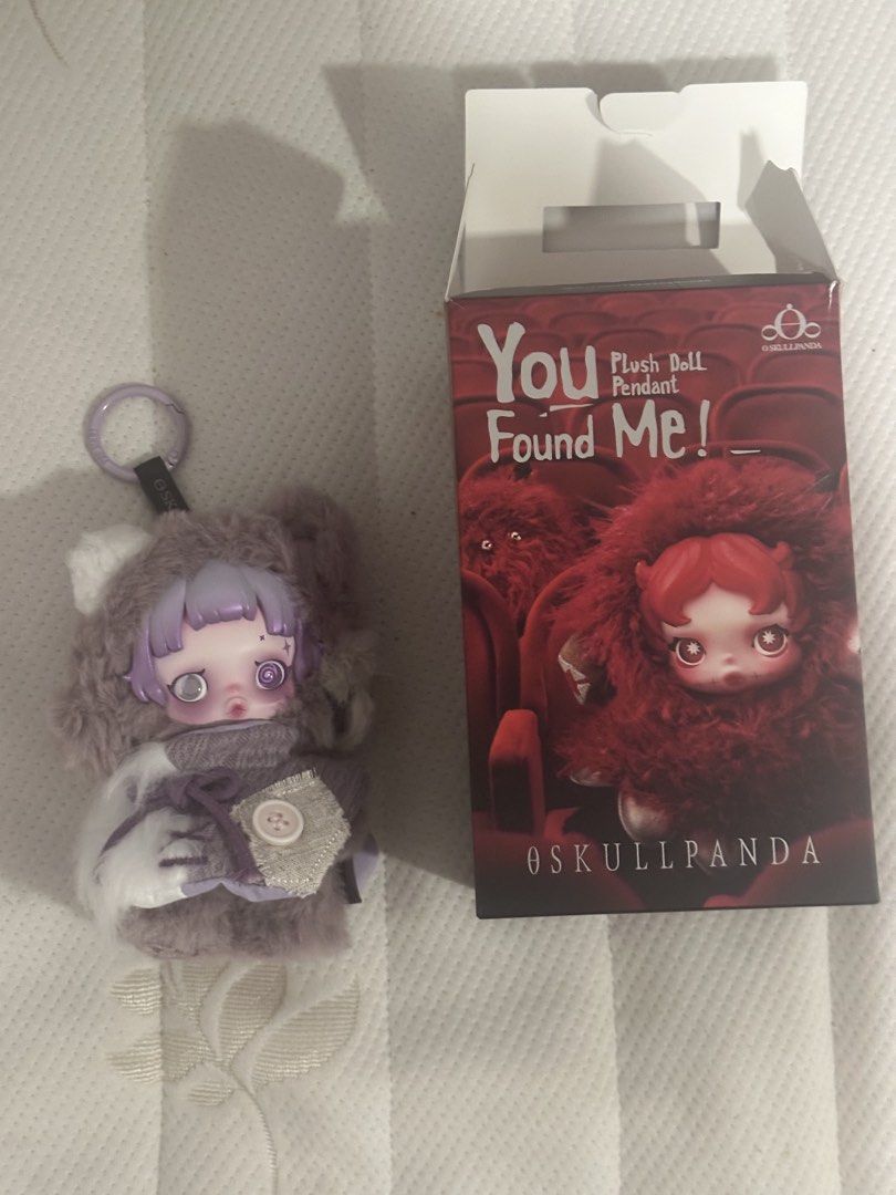 Skullpanda You Found Me! Plush Doll Pendant (Category: Plushies & Soft Toys) located in Makati City. Submitted by elenank.595 (Listing ID 1431389730, Image 3). Description: Adorable Skullpanda plush doll pendant in purple and gray “Ratty Bear” from “You found me”. Includes original box, collectible card, and keychain. Cute outfit with button detail. Perfect for collectors!.