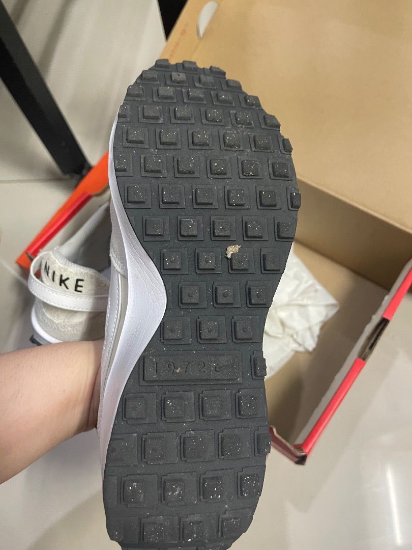 Super Sale 2 Nike Sneakers (Category: Sneakers) located in Quezon City. Submitted by hellopatchi (Listing ID 1431417016, Image 3). Description: 2 Original Nike shoes Size 7 with boxes Slightly unused 2k each 3,500 for 2 - Nike Waffle One sneakers - White and grey color scheme - Visible Nike logo on heel - Minor wear on sole - Comes with original box.