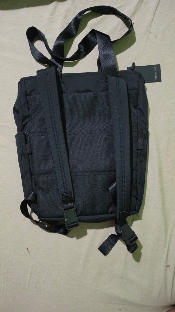 Timbuk2 Scholar Tote Pack Eco Black (Category: Tote Bags) located in Binmaley. Submitted by jner_122 (Listing ID 1431516485, Image 2). Description: - Timbuk2 Scholar Tote Pack - Color: Black -Internal slip pocket fits up to a 13'' laptop -Adjustable and tuckable backpack straps -Two front zip pockets for wallet, keys, and other small items -Dual side pockets fit water bottle, umbrella or mini U-lock -Anti-authority pocket - Zippered main compartm