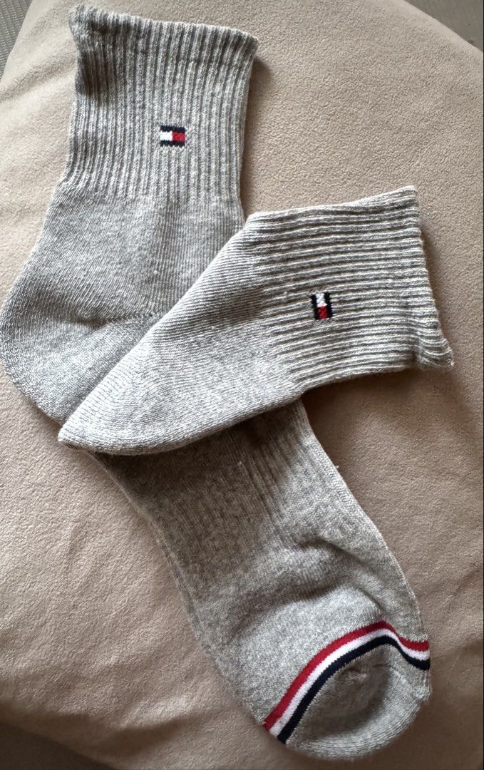 Tommy Hilfiger Gray Socks (Category: Socks) located in Quezon City. Submitted by decluttrqueen (Listing ID 1431404999, Image 1). Description: - Tommy Hilfiger socks - Color: Gray - Features the Tommy Hilfiger logo - Red, white, and blue stripes on the toe area - Ribbed texture - Unworn condition.