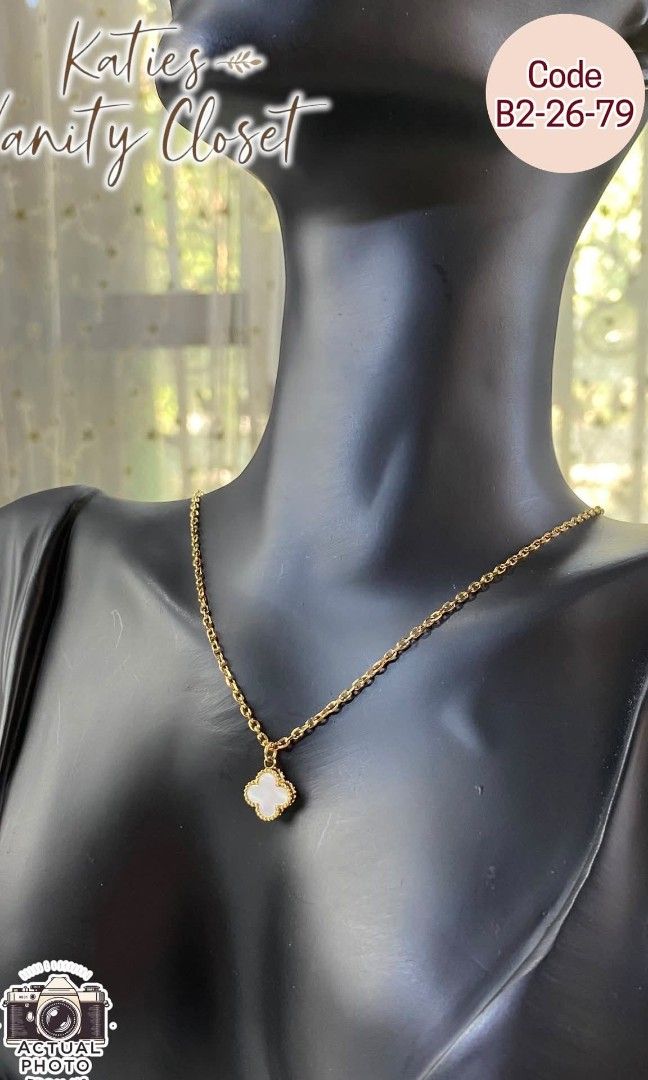 VAN CLEEF & ARPELS CLOVER NECKLACE - SMALL PENDANT MINIMALIST NECKLACE - CODE B22679 (Category: Necklaces) located in Rizal. Submitted by vickypeiwanggo (Listing ID 1431558071, Image 2). Description: The necklace in the image is a white clover pendant necklace, heavily inspired by the iconic Van Cleef & Arpels Alhambra collection. This specific version appears to be a mother-of-pearl or white enamel inlay set in a gold-toned beaded frame. Key Fea