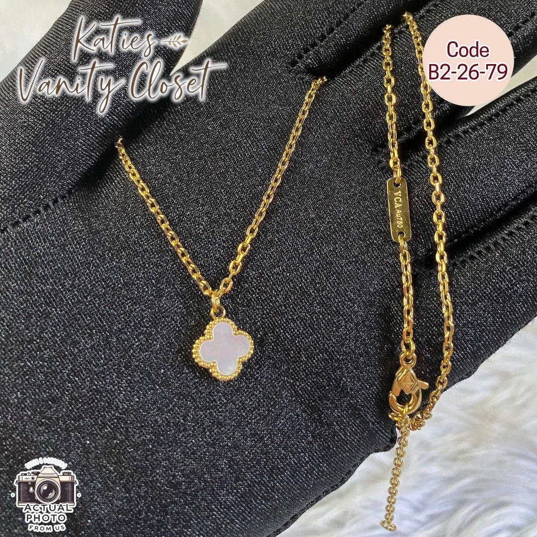 VAN CLEEF & ARPELS CLOVER NECKLACE - SMALL PENDANT MINIMALIST NECKLACE - CODE B22679 (Category: Necklaces) located in Rizal. Submitted by vickypeiwanggo (Listing ID 1431558071, Image 1). Description: The necklace in the image is a white clover pendant necklace, heavily inspired by the iconic Van Cleef & Arpels Alhambra collection. This specific version appears to be a mother-of-pearl or white enamel inlay set in a gold-toned beaded frame. Key Fea