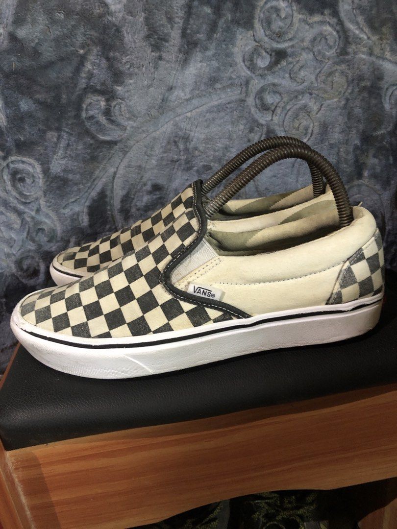 Vans Checkerboard Slip-On Sneakers (Category: Sneakers) located in Manila. Submitted by blufinds (Listing ID 1431410886, Image 2). Description: - Classic Vans slip-on style - Black and white checkerboard pattern - White sole - Vans logo detail - Well-maintained condition - Stylish and versatile.