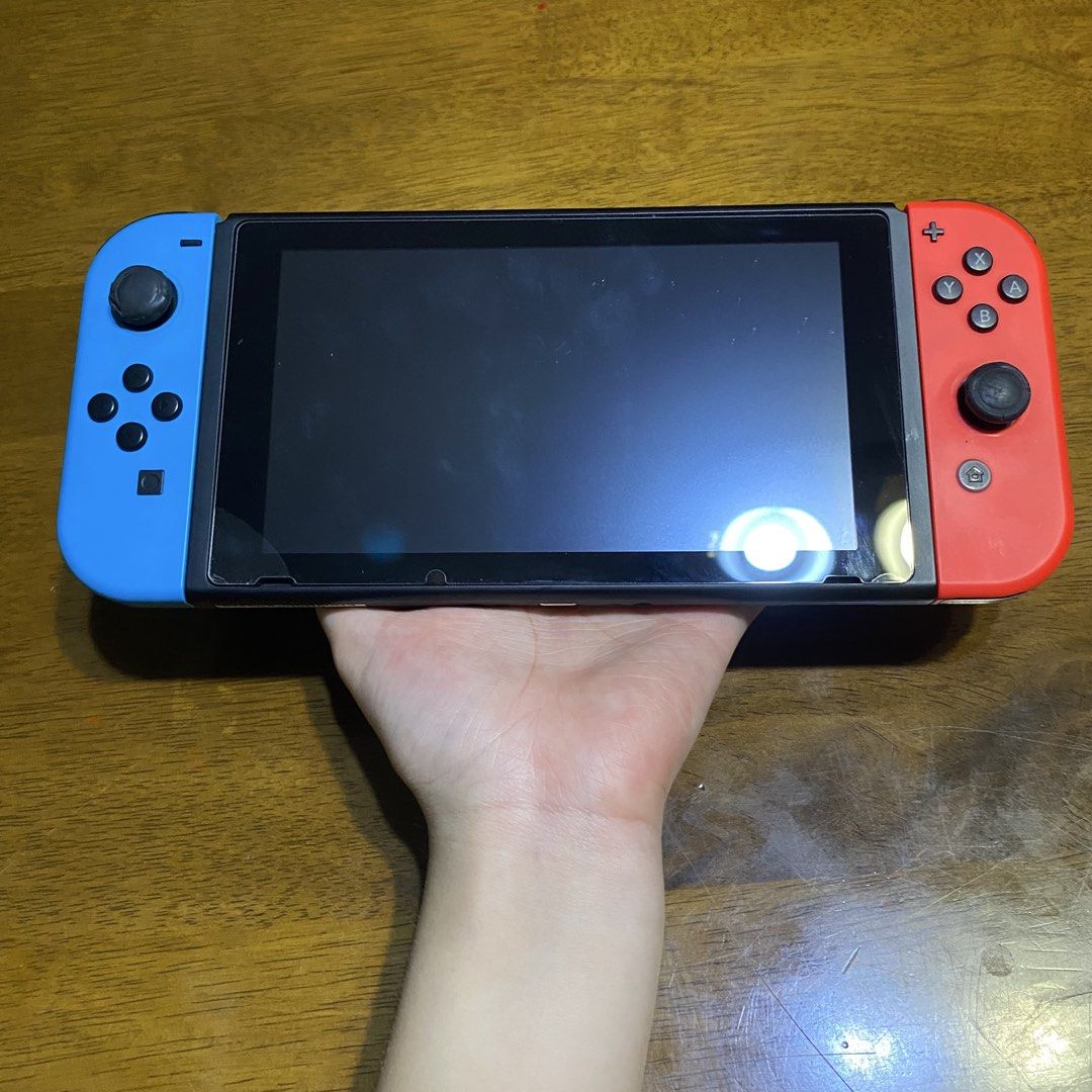 Version 1 Nintendo Switch Bundle (Category: Nintendo) located in Quezon City. Submitted by chartreuse2018 (Listing ID 1431501367, Image 2). Description: Nintendo Switch Bundle: Original Box HDMI cable AC Adapter Dock Joy-con grip Freebies: Carrying Case & Protective Shell Thumb grips -rubber is slightly worn-out on joycon sticks and kickstand rubber -no joycon drift (price is negotiable) -PM for more pics or questions.