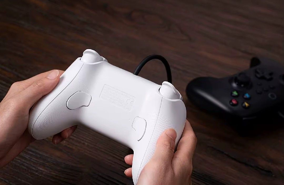 8BitDo Ultimate Wired Controller (Black) (Category: Controllers) located in Singapore. Submitted by khatib_wave (Listing ID 1431747530, Image 2). Description: Genuine 8BitDo Wired Controller in black. Boughy for $55 but never used it much. Has two back paddles, remappable with software. DM for pictures. Open to trade with a wireless controller as well..