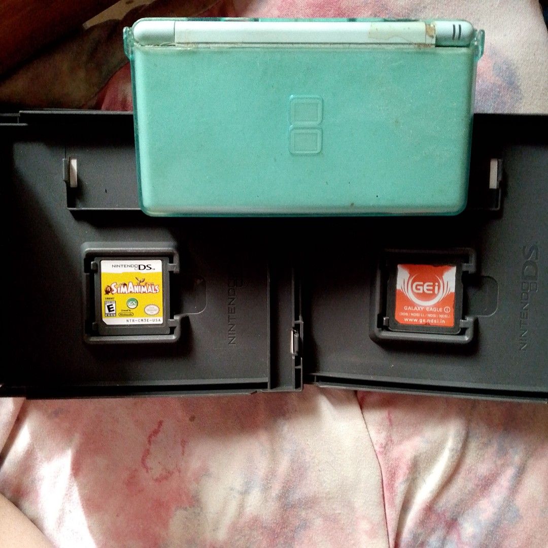 🎮 Nintendo DS Lite Bundle (For Repair / As Is) (Category: Nintendo) located in Binan City. Submitted by godgiven117 (Listing ID 1431576754, Image 2). Description: 📌 PLEASE READ / MAKE A READING HABIT — FOR SERIOUS BUYERS ONLY 🎮 Nintendo DS Lite Bundle (For Repair / As Is) 📦 Inclusions: • Nintendo DS Lite (Mint green) • 1 Game: The Sims Animals (with case) • 1 Cartridge: Galaxy Eagle (R4-type / flashcart) with authentic case (used as its case)