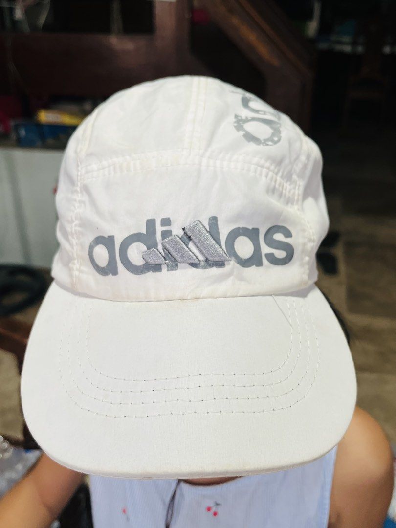 Adidas Adicolor Five-Panel Cap (Category: Caps & Hats) located in Mandaue City. Submitted by chuchi152615 (Listing ID 1431726405, Image 1). Description: - White Adidas cap - Adidas logo on front and side - Curved brim - Adjustable strap - Lightweight material.