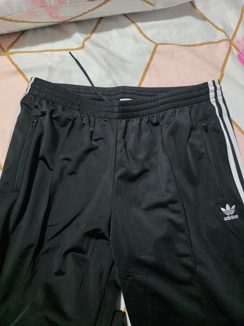 Adidas Womens Track Pants XL (Category: Coats, Jackets and Outerwear) located in Mandaluyong City. Submitted by summerinjun (Listing ID 1431786789, Image 2). Description: - Adidas womens track pants - Color: Black with white stripes - Size: XL -Canada bought - Features: Drawstring waist, side pockets - Condition: Brand new with original tags - Design: Classic Adidas three stripes .