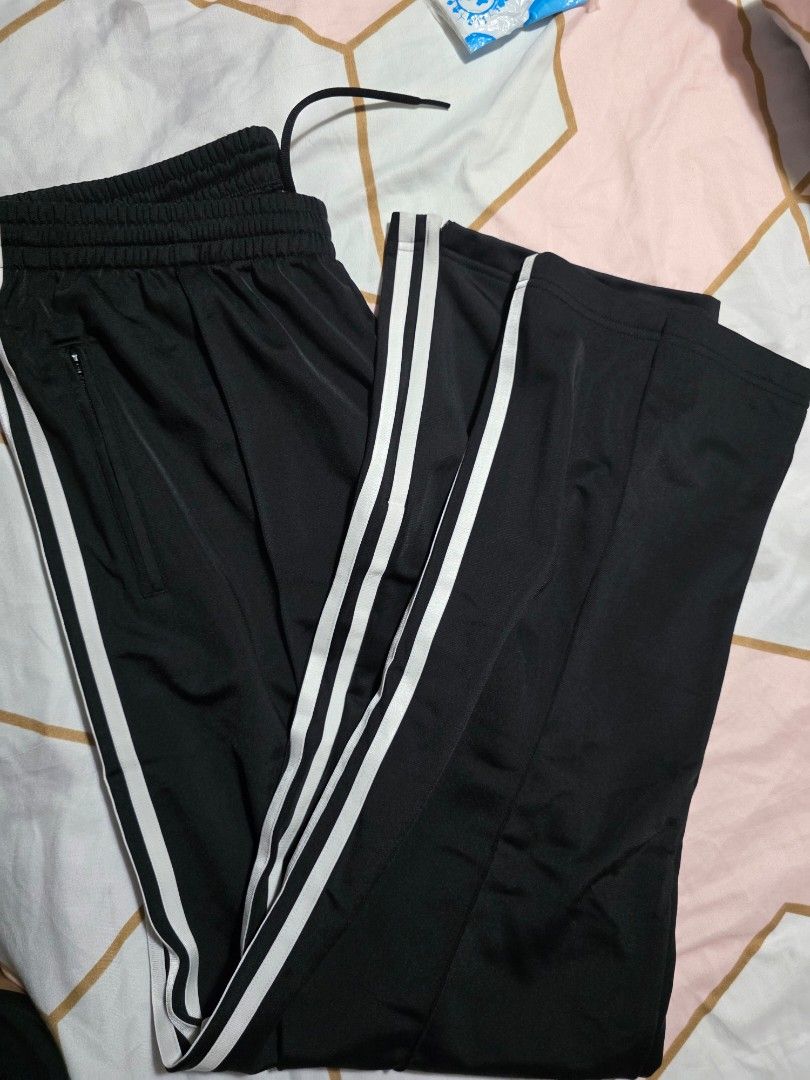 Adidas Womens Track Pants XL (Category: Coats, Jackets and Outerwear) located in Mandaluyong City. Submitted by summerinjun (Listing ID 1431786789, Image 3). Description: - Adidas womens track pants - Color: Black with white stripes - Size: XL -Canada bought - Features: Drawstring waist, side pockets - Condition: Brand new with original tags - Design: Classic Adidas three stripes .