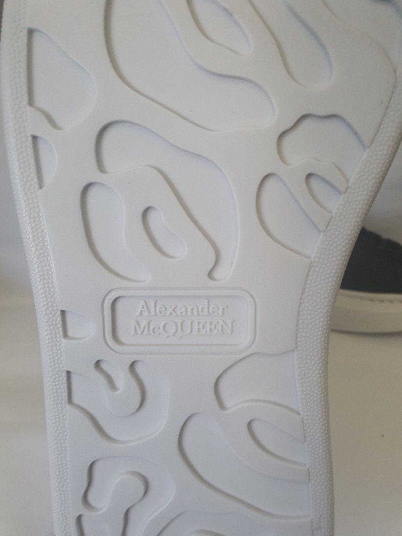 Alexander McQueen Oversized Sneakers Black White (Category: Sneakers) located in Makati City. Submitted by noel.profile (Listing ID 1431672604, Image 3). Description: - Alexander McQueen oversized sneakers - Black leather upper - White sole - McQueen logo on tongue and sole - Lace-up closure - Chunky sole - Side perforations - Unique sole pattern for grip.