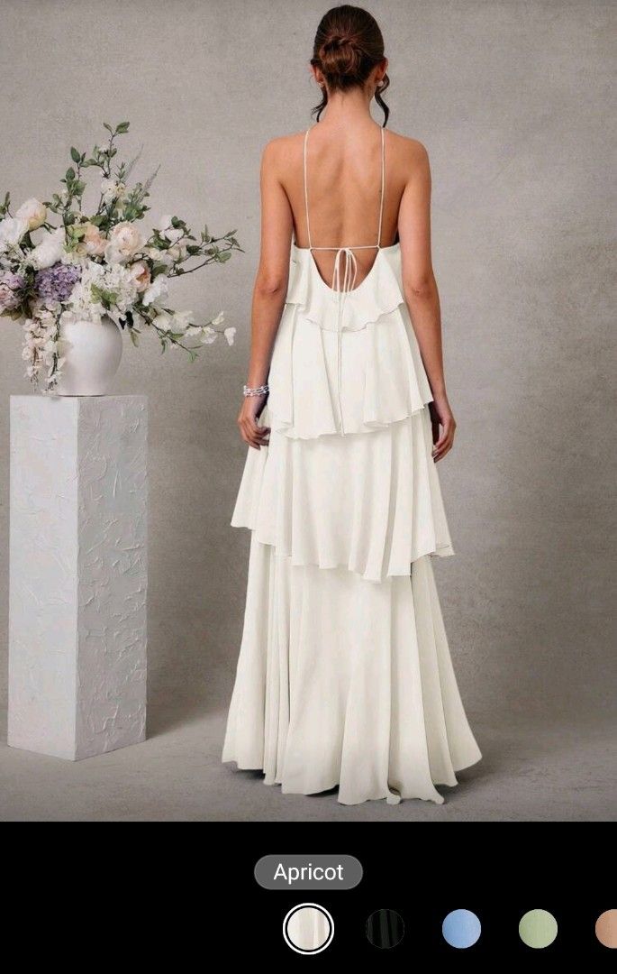 Apricot Ruffled Halter Maxi Dress (Category: Dresses) located in Quezon City. Submitted by cdm19 (Listing ID 1431789057, Image 2). Description: - Apricot maxi dress - Halter neckline - Layered ruffle bodice - Flowing, floor-length skirt - Delicate tie-back detail - Perfect for special occasions.