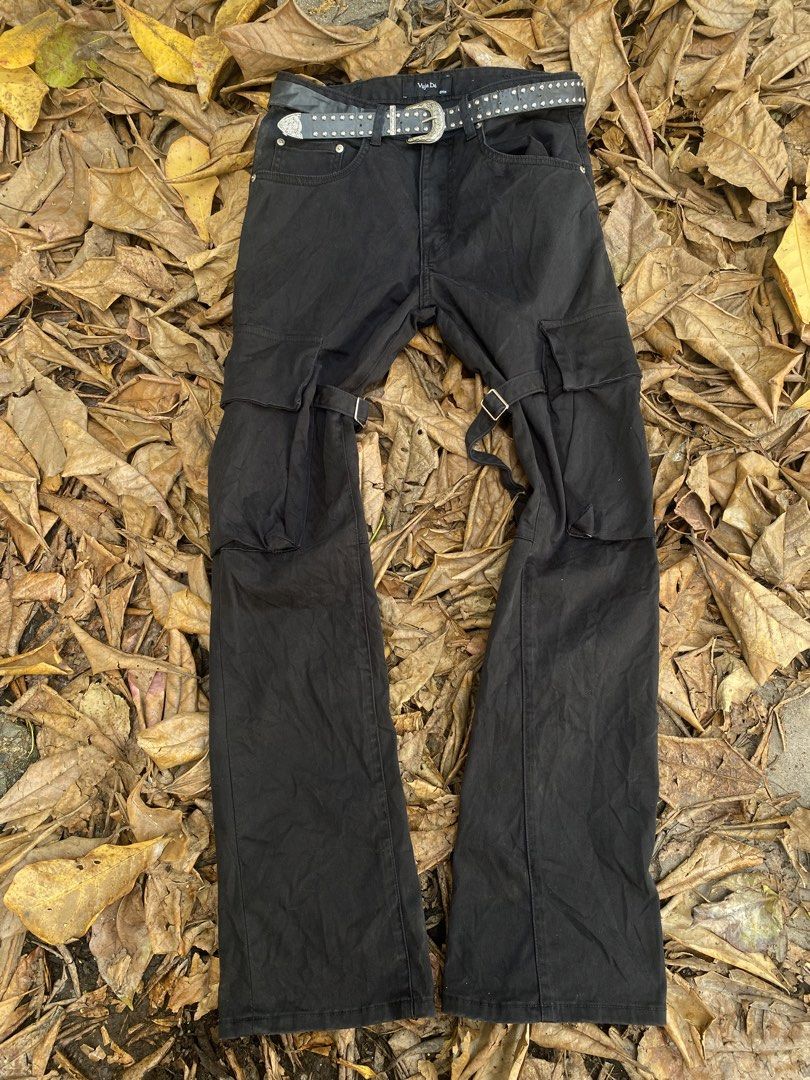 Archive Vuja De 2019 Bondage Flare Cargo Pants (Category: Jeans) located in Iligan City. Submitted by trickorthrift1 (Listing ID 1431642865, Image 1). Description: Rare 2019 release from Vuja De, featuring their signature bondage-inspired detailing and modern flare silhouette. These black cargo pants showcase a clean yet utilitarian aesthetic, equipped with multiple functional pockets and adjustable strap elements that give it a distinct techwear