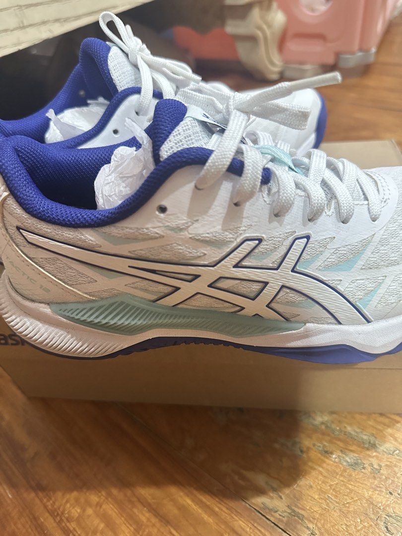 Asics Gel-Tactic 12 coloway white/eggplant (Category: Sneakers) located in Manila. Submitted by bueleboutique (Listing ID 1431674487, Image 1). Description: Size says best fit US 5.5 but will fit more if you are not wide feet (best fit US 4-5) Perfect for court indoor sports Used once With box With slight stain see photo but not that visible.