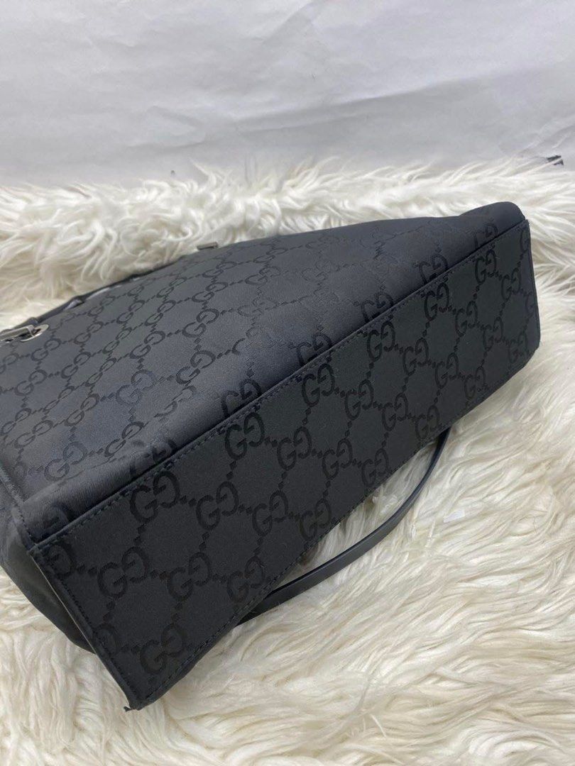 Authentic Gucci Bamboo GG Canvas Tote (Category: Luxury Bags & Wallets) located in Quezon City. Submitted by arleeeneb (Listing ID 1431716631, Image 2). Description: • Material: Durable Black Nylon GG Canvas • Handles: Genuine Natural Bamboo • Size: 30cm x 24cm (The perfect daily size!) • Condition: Good vintage condition. ✨ Lifetime money-back guarantee. ✨ Buy with confidence. ✨ DM for more photos or to checkout!.