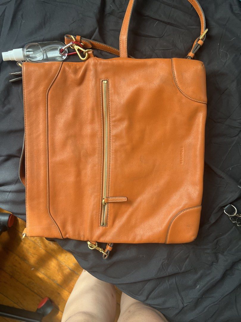 Beanpole Leather Convertible sling Shoulder Bag (Category: Shoulder Bags) located in Makati City. Submitted by tilli28 (Listing ID 1431576942, Image 3). Description: - Brand: Beanpole - Style: Leather Shoulder Bag - Color: Orange - Features: Top handle, detachable shoulder strap - Closure: Zipper - Hardware: Gold-tone - Design: Sleek and spacious - Additional: Front flap with magnetic closure. Ideal for everyday use..