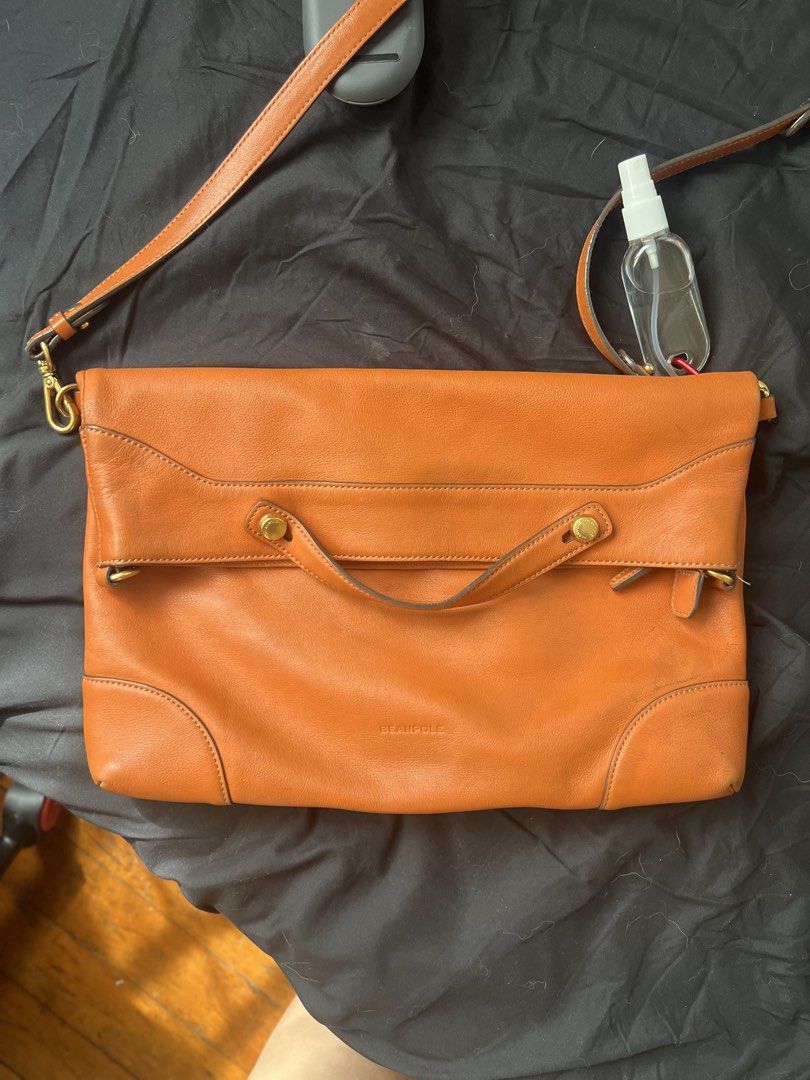 Beanpole Leather Convertible sling Shoulder Bag (Category: Shoulder Bags) located in Makati City. Submitted by tilli28 (Listing ID 1431576942, Image 1). Description: - Brand: Beanpole - Style: Leather Shoulder Bag - Color: Orange - Features: Top handle, detachable shoulder strap - Closure: Zipper - Hardware: Gold-tone - Design: Sleek and spacious - Additional: Front flap with magnetic closure. Ideal for everyday use..