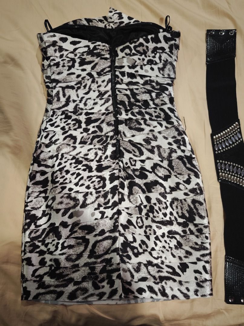 Bebe Strapless Dress with Belt (Category: Dresses) located in Quezon City. Submitted by declutteringmami (Listing ID 1431665071, Image 2). Description: - Bebe strapless padded dress - Eye-catching animal print - Includes matching black belt with decorative details - Size: XXS - Fitted silhouette - Perfect for various occasions.
