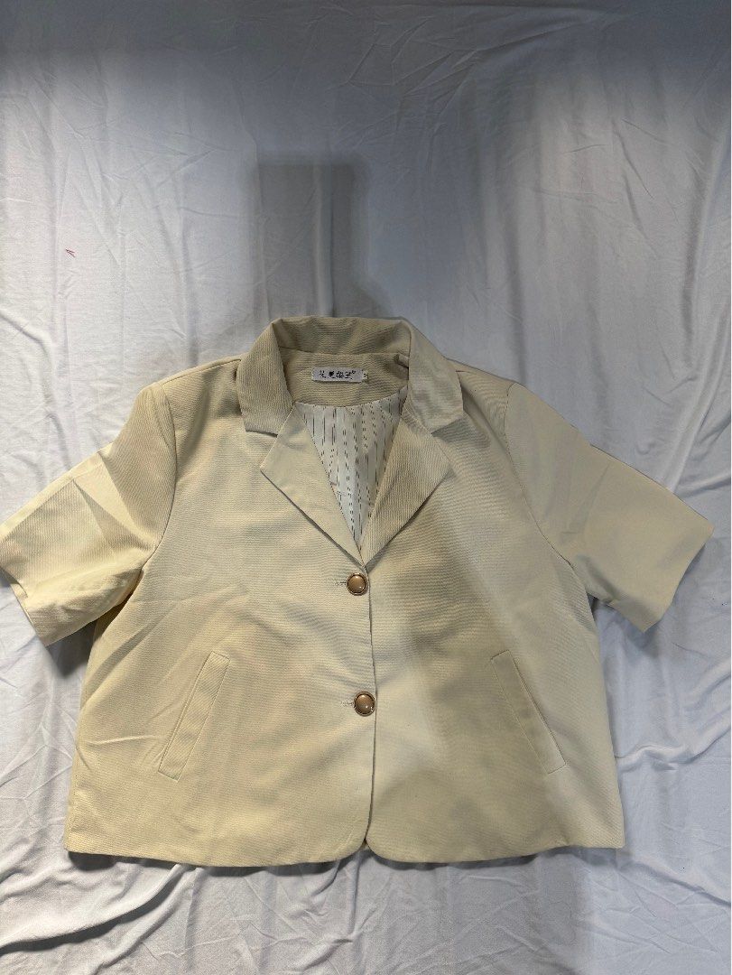 Beige Vest with Gold Buttons - Size M (Category: Sleeveless) located in Manila. Submitted by raphaelain17296 (Listing ID 1431735498, Image 2). Description: - Beige vest - Features two gold buttons - Includes two front pockets - Striped lining - Size: M - Brand tag in Chinese characters.