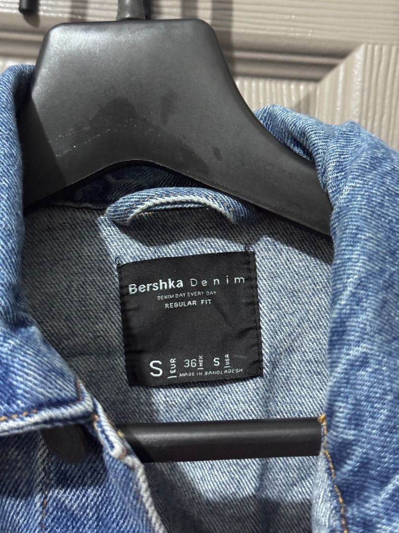 Bershka Denim Jacket - Regular Fit - Small (Category: Coats, Jackets and Outerwear) located in Quezon City. Submitted by afpar (Listing ID 1431592152, Image 2). Description: - Bershka denim jacket - Size: S - Fit: Regular - Color: Light blue wash - Features: Button-up front, chest pockets, collar - Made in Bangladesh - Classic design - Ideal for everyday wear.