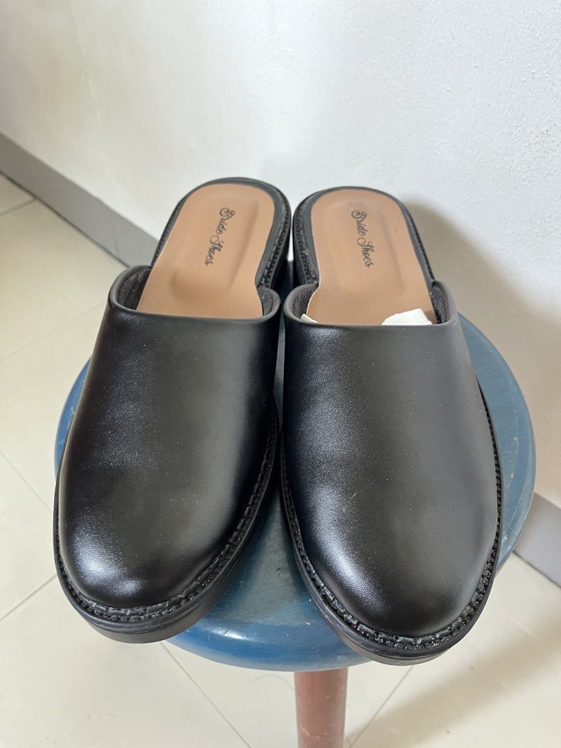 Black Leather Mules (Category: Dress Shoes) located in Las Pinas. Submitted by solfits (Listing ID 1431606639, Image 3). Description: [brand new] black synthetic leather mules * haven't worn them outside * size 44 (27cm) * glue/adhesive aren't that neat (brought from an indonesian brand on 🍊) * overall condition is great * no box inclusion.