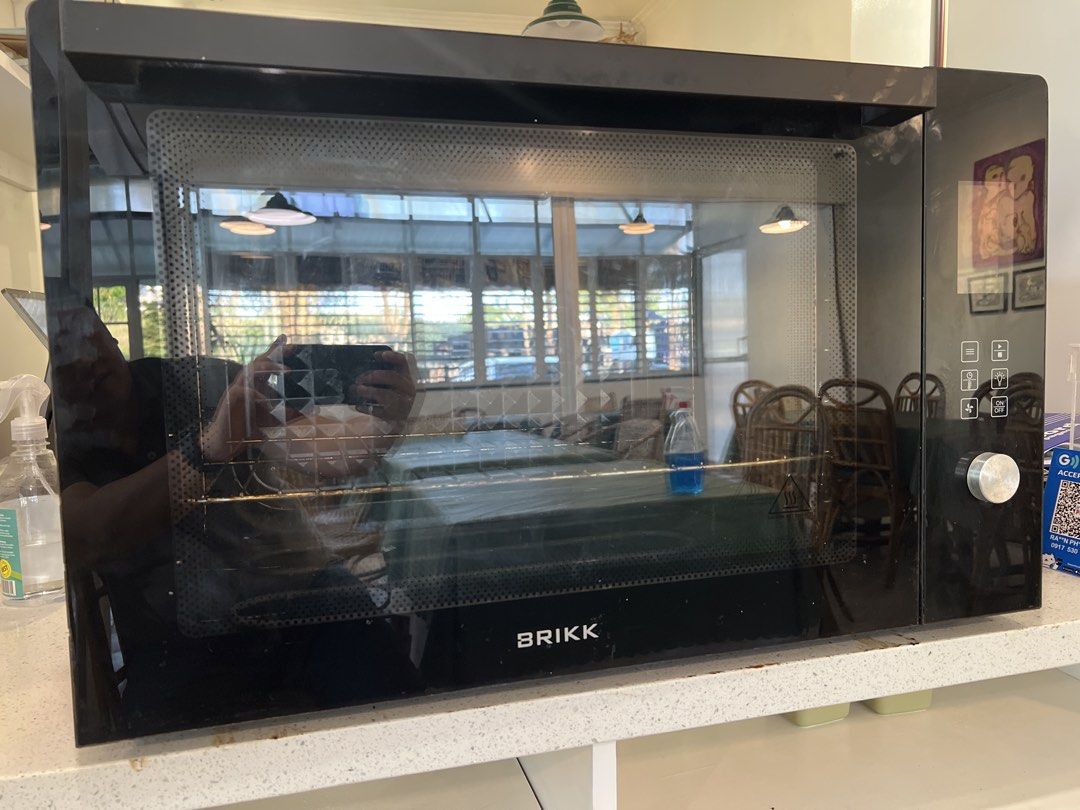 Brikk Microwave Oven 100 liters (Category: Ovens & Toasters) located in Manila. Submitted by lifestylers.media (Listing ID 1431673448, Image 1). Description: - Brikk microwave oven 100liters - Black and red exterior with glass door - Silver back - Includes rack and heating elements - Control panel with multiple settings - In good working condition.