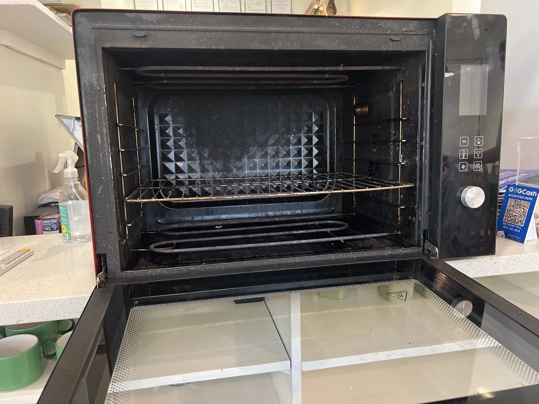 Brikk Microwave Oven 100 liters (Category: Ovens & Toasters) located in Manila. Submitted by lifestylers.media (Listing ID 1431673448, Image 2). Description: - Brikk microwave oven 100liters - Black and red exterior with glass door - Silver back - Includes rack and heating elements - Control panel with multiple settings - In good working condition.
