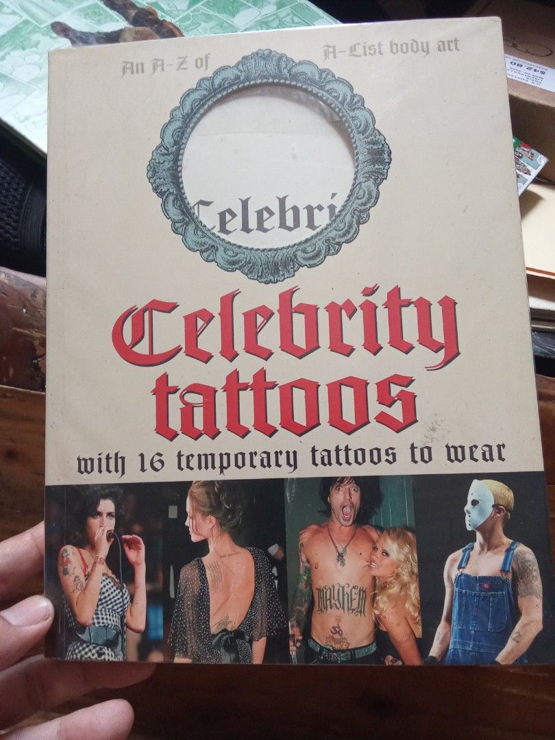 Celebrity Tattoos Book (Category: Storybooks) located in Pasig City. Submitted by teebeedeee (Listing ID 1431612696, Image 1). Description: - Discover celebrity tattoos in this book! - Features an A-Z of A-list body art. - Includes 16 exclusive temporary tattoos. - Over 100 color photographs. - Stories behind the tattoos are included. - Features celebrities like Angelina, Pamela, Johnny, and Ozzy. preowned authentic softcover copy complete full c