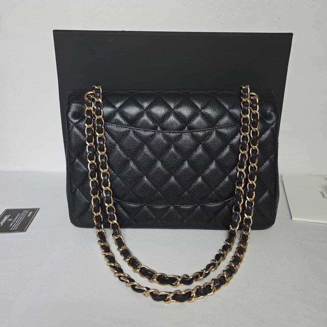 Chanel Classic Flap Bag Black Caviar Leather (Category: Luxury Bags & Wallets) located in Quezon City. Submitted by dhexyoblepias (Listing ID 1431592679, Image 2). Description: - Authentic Chanel Classic Flap bag - Black caviar leather - Diamond-quilted exterior - Signature CC turn-lock closure - Chain-and-leather strap - Burgundy leather interior - Multiple compartments - Includes box and authenticity card.