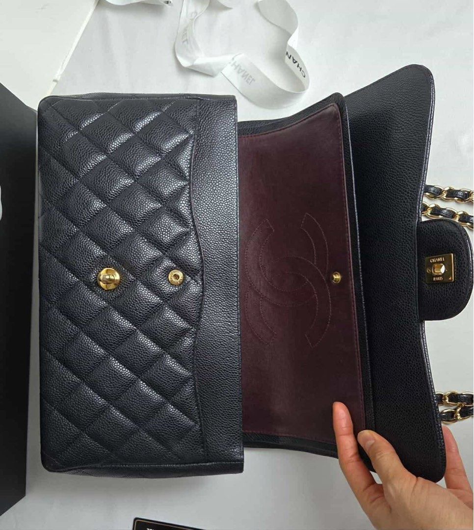 Chanel Classic Flap Bag Black Caviar Leather (Category: Luxury Bags & Wallets) located in Quezon City. Submitted by dhexyoblepias (Listing ID 1431592679, Image 3). Description: - Authentic Chanel Classic Flap bag - Black caviar leather - Diamond-quilted exterior - Signature CC turn-lock closure - Chain-and-leather strap - Burgundy leather interior - Multiple compartments - Includes box and authenticity card.